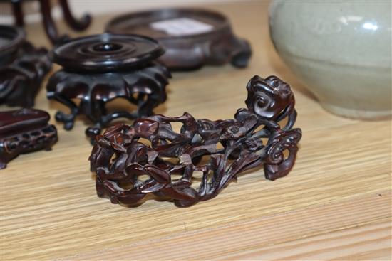 A group of seven Chinese carved wood stands, 19th / 20th century